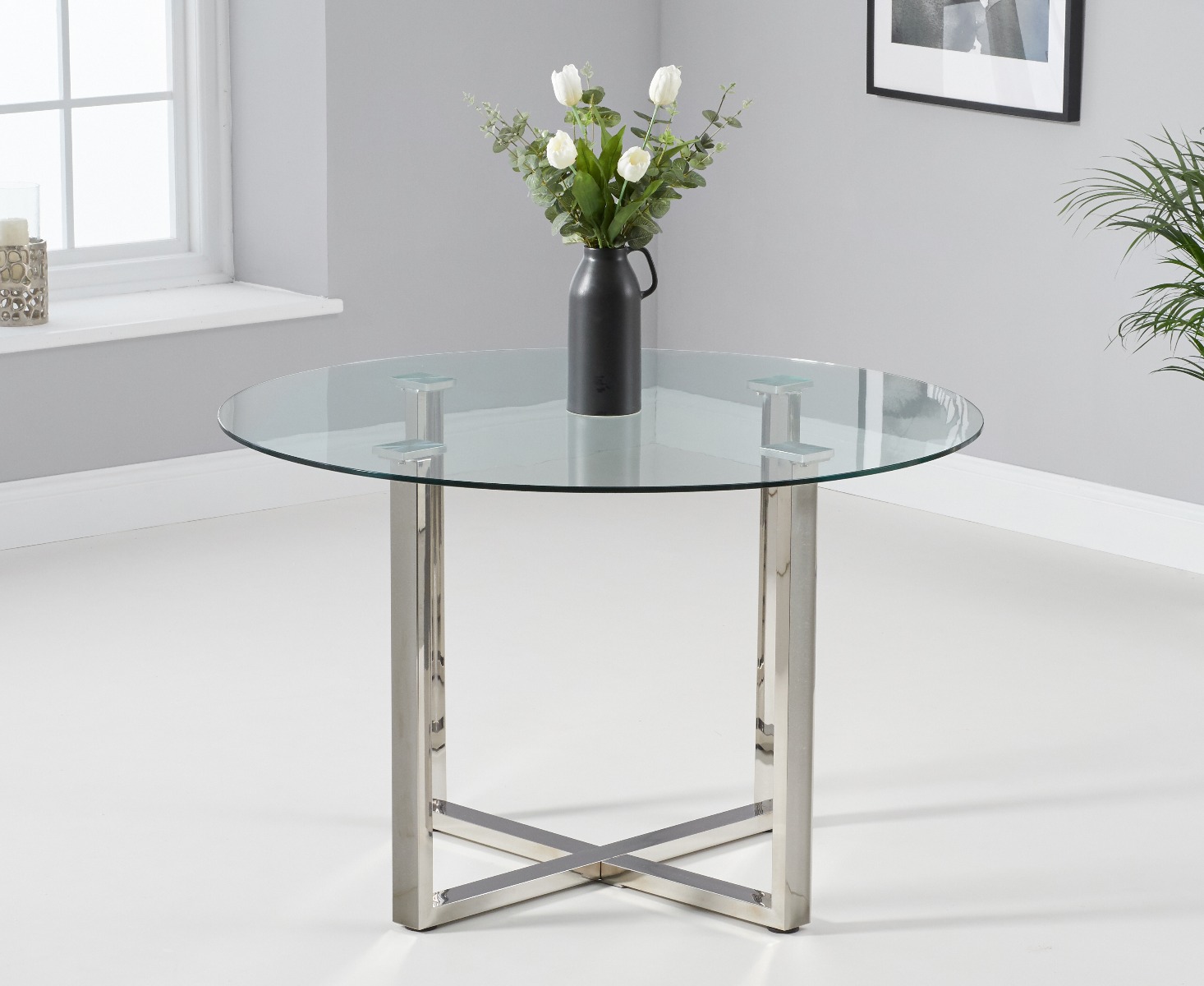 Product photograph of Vaso 120cm Round Glass Dining Table from Oak Furniture Superstore