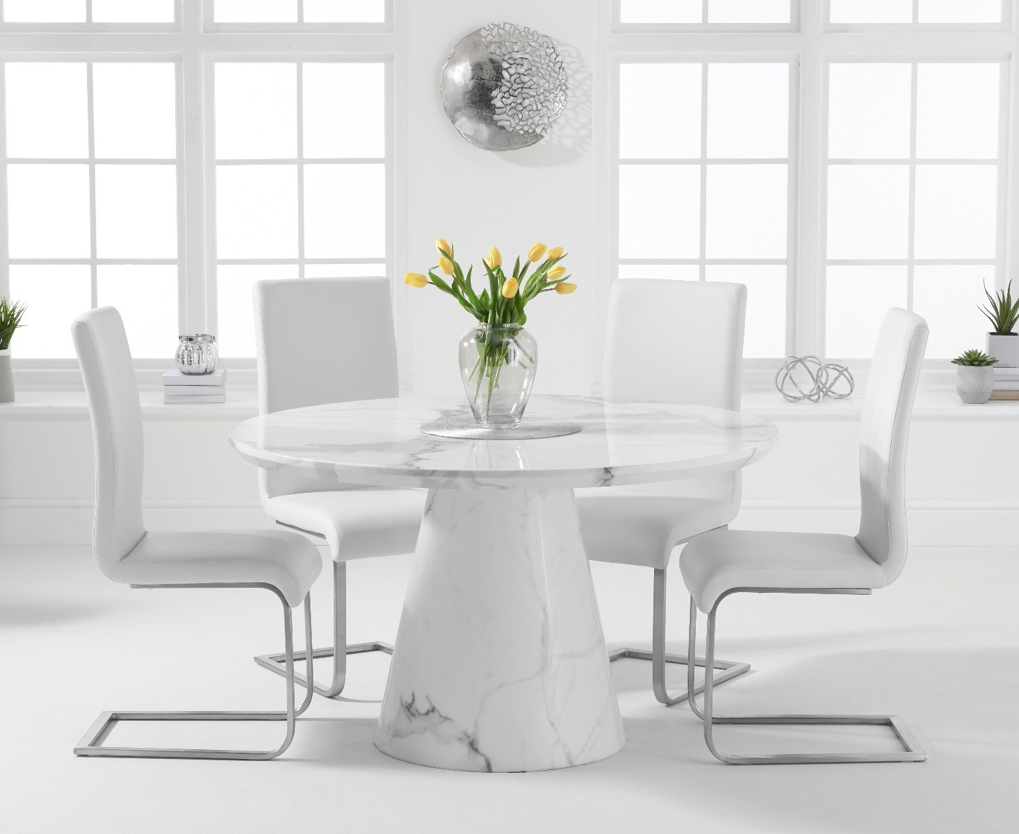 Product photograph of Ravello 130cm Round White Marble Dining Table With 6 White Malaga Chairs from Oak Furniture Superstore