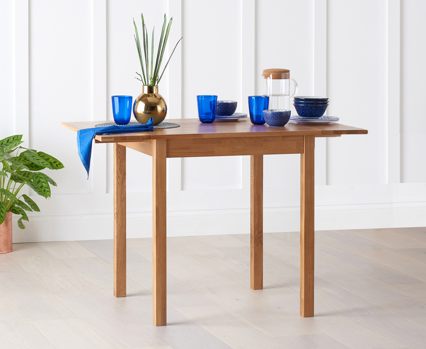 Product photograph of Oxford 70cm Solid Oak Drop Leaf Extending Dining Table from Oak Furniture Superstore