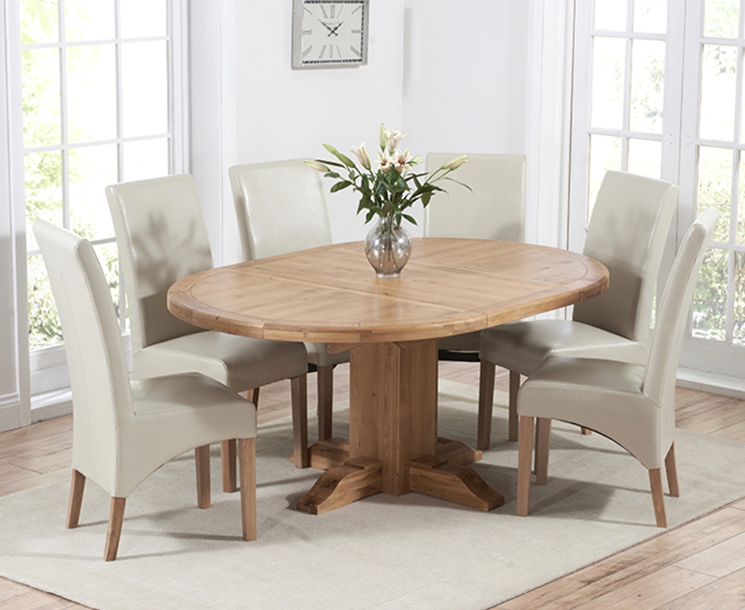 Product photograph of Torino Solid Oak Extending Pedestal Dining Table With 4 Grey Cannes Chairs from Oak Furniture Superstore