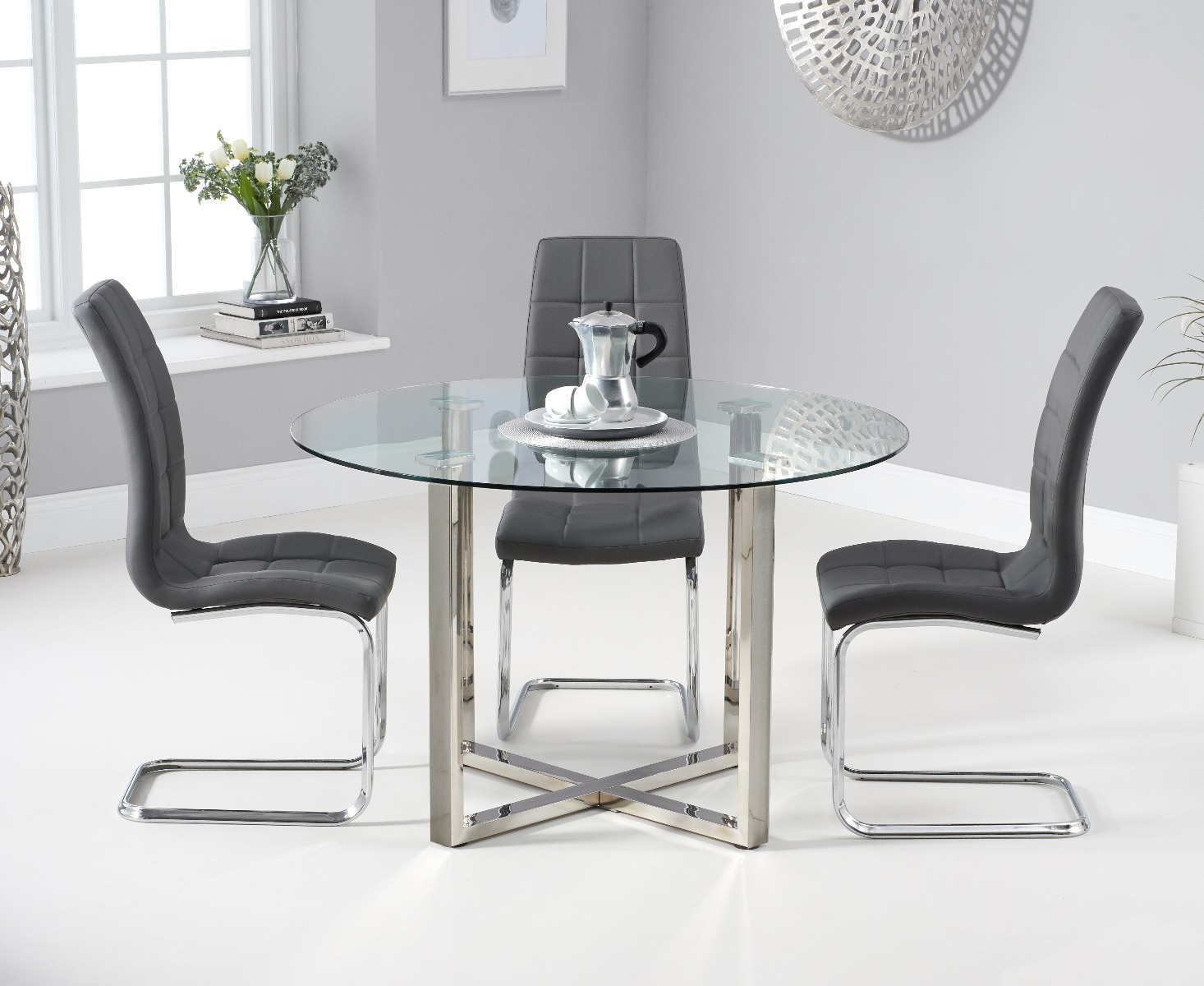 Product photograph of Vaso 120cm Round Glass Dining Table With 4 Black Vigo Dining Chairs from Oak Furniture Superstore