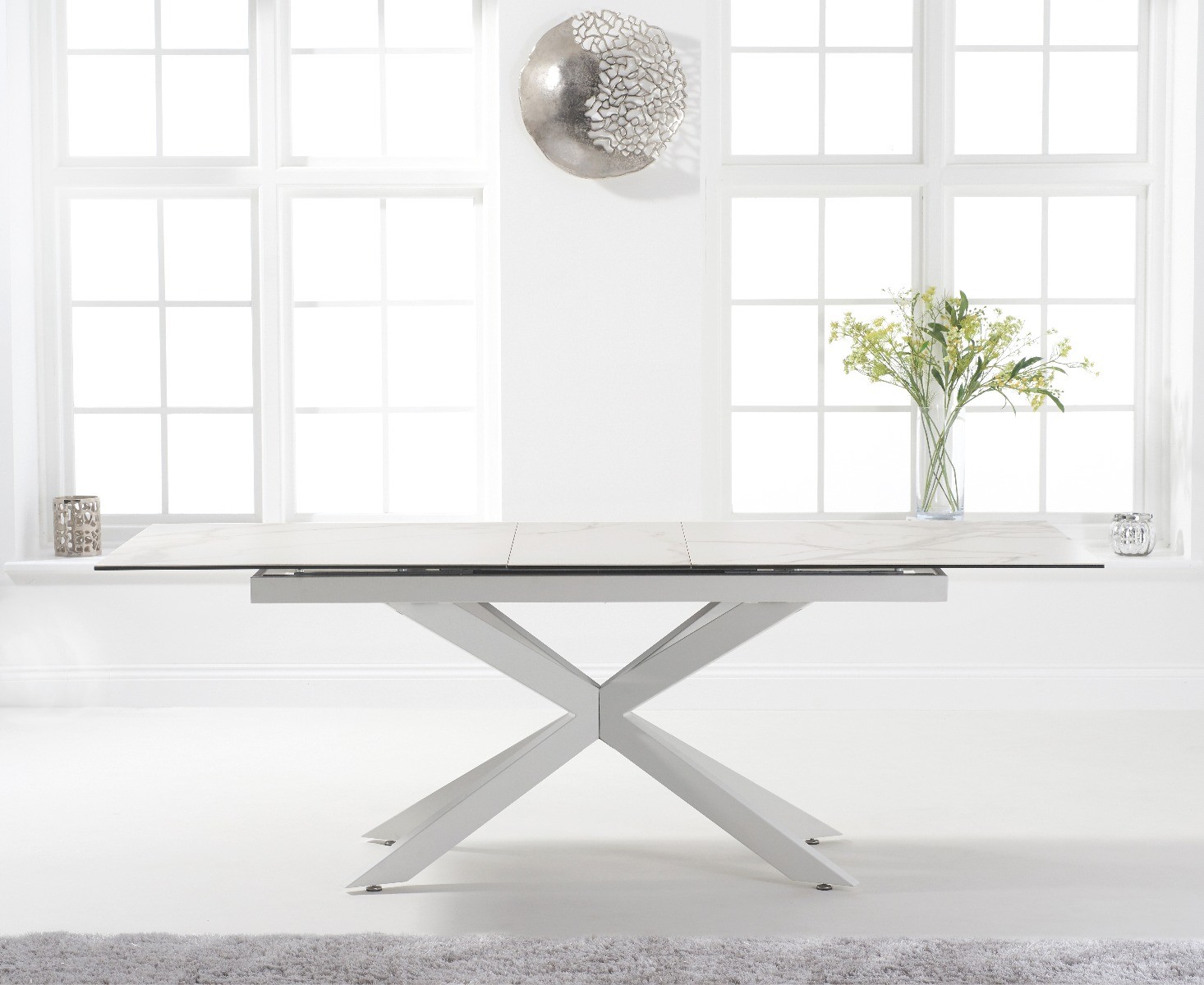 Photo 1 of Extending boston 180cm white ceramic dining table with white leg