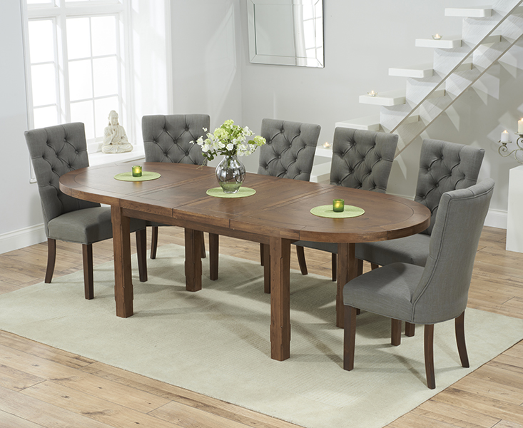 Photo 1 of Caversham dark oak extending dining table with 8 grey francois fabric dark oak leg chairs
