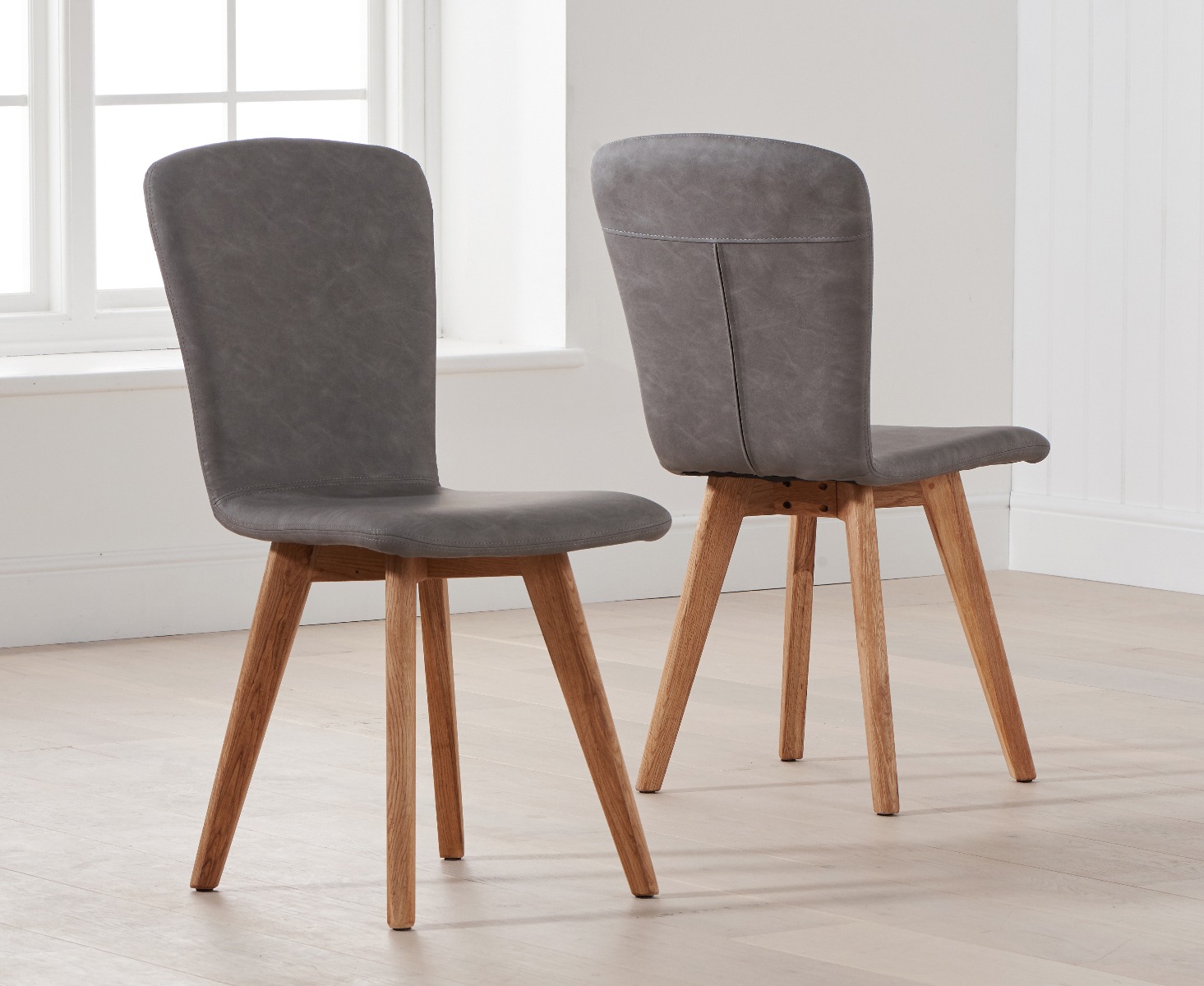 Product photograph of Ruben Retro Faux Leather Grey Dining Chairs from Oak Furniture Superstore