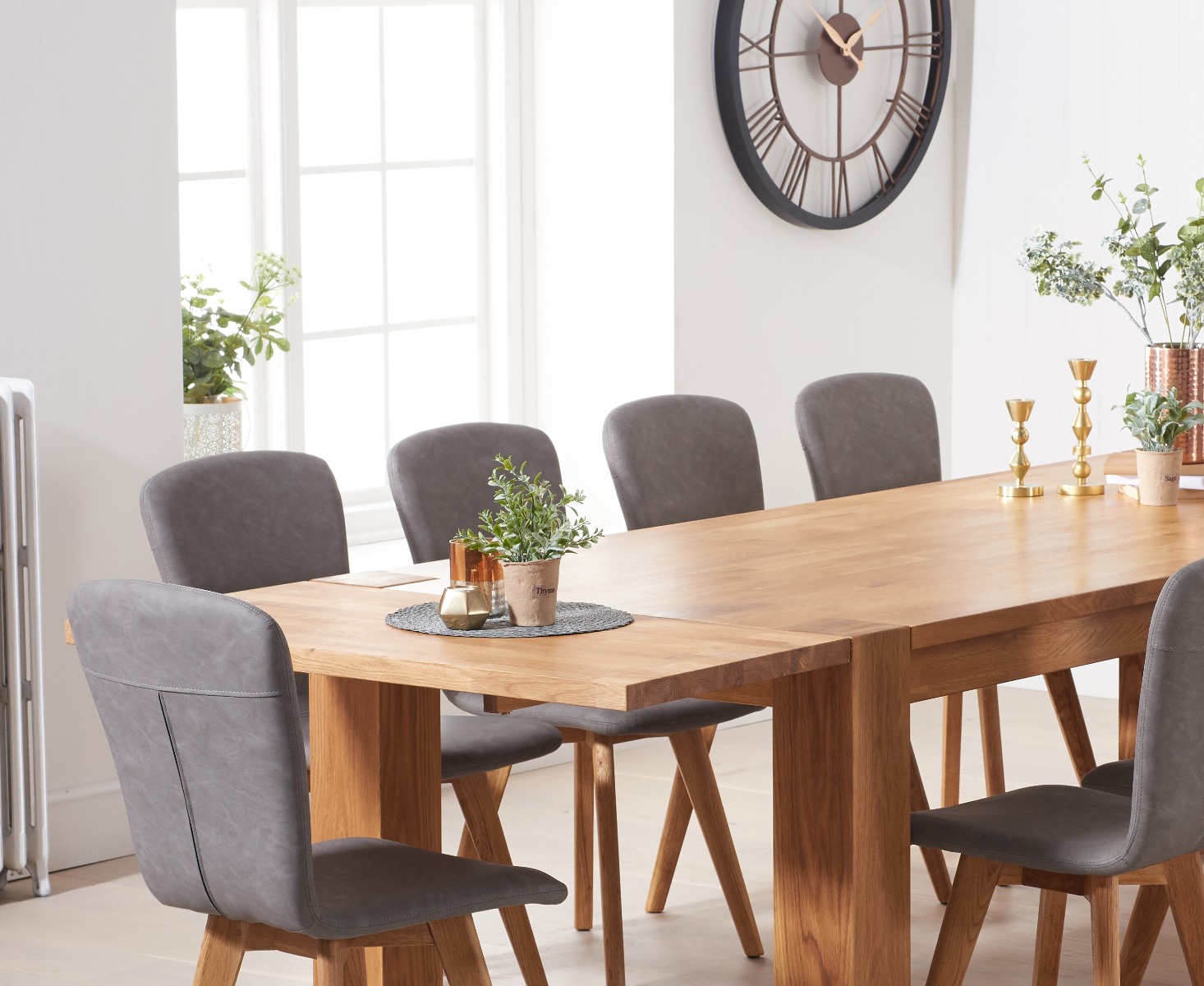 Photo 1 of Extending sheringham 240cm solid oak table with 10 grey ruben faux leather chairs