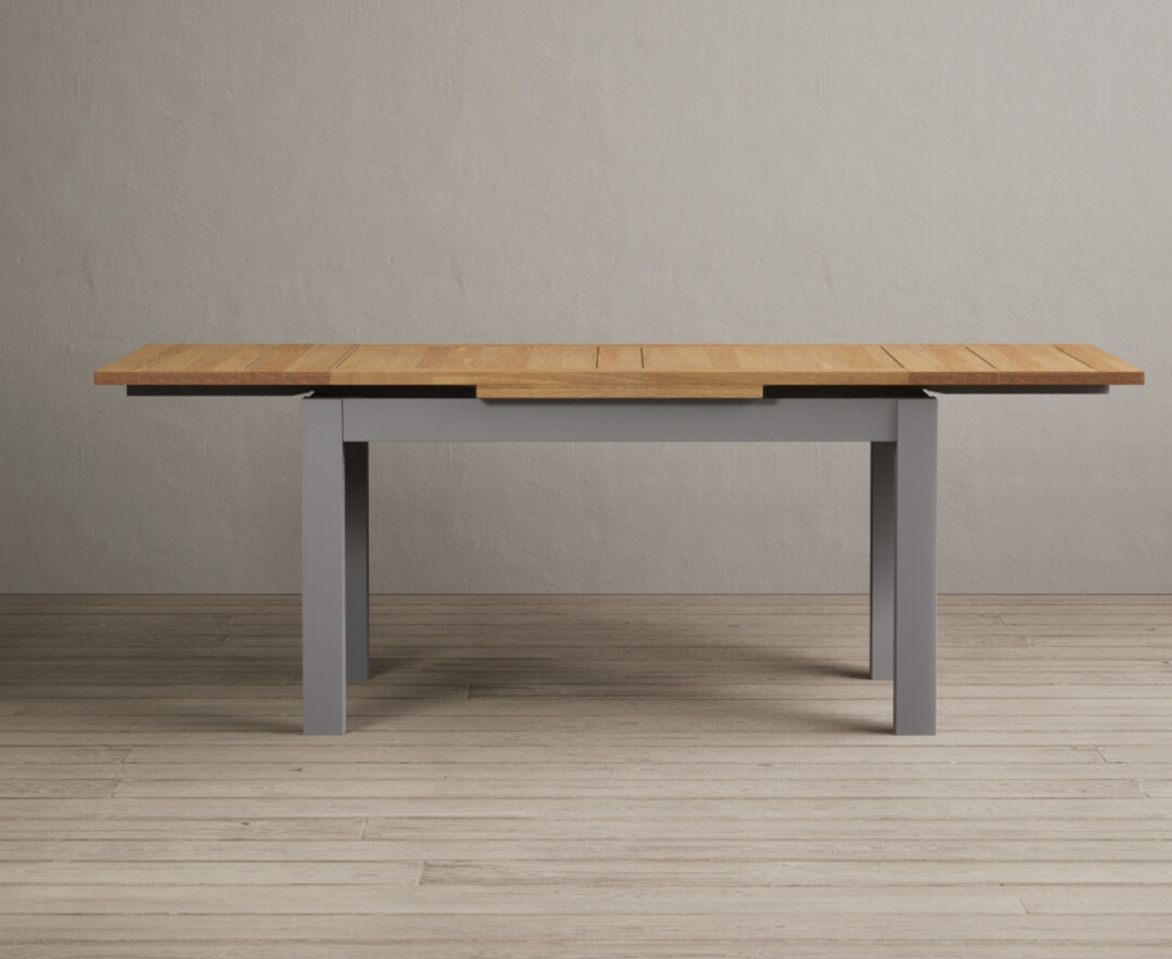 Product photograph of Extending Buxton 140cm Oak And Light Grey Painted Dining Table from Oak Furniture Superstore