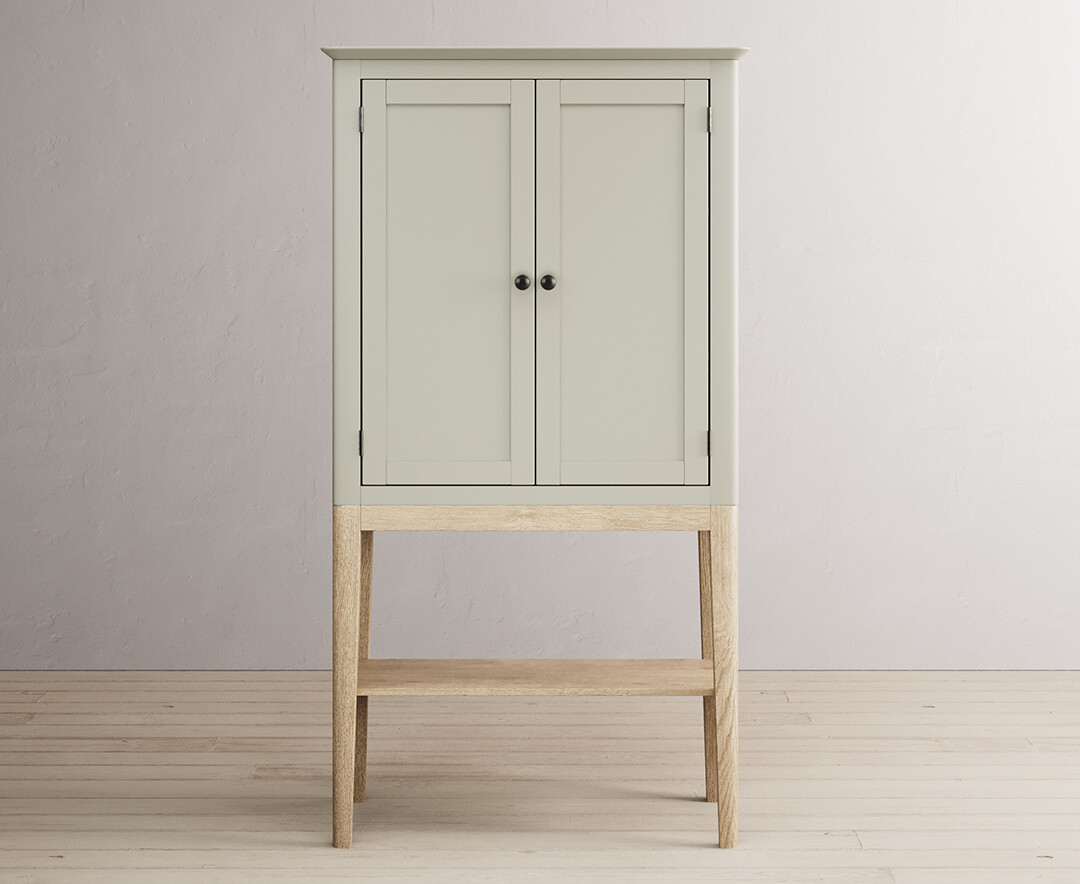 Product photograph of Ancona Oak And Soft Green Painted Tall Storage Cabinet from Oak Furniture Superstore