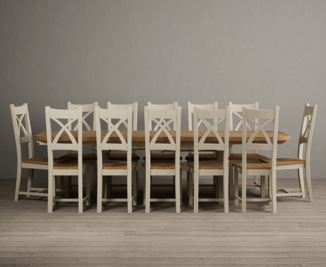 Photo 1 of Extending atlas 180cm oak and cream dining table with 12 brown x back chairs