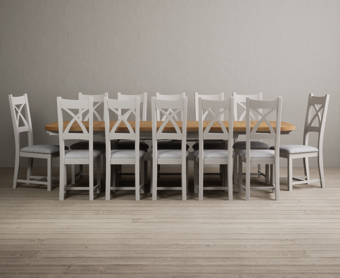 Product photograph of Atlas 180cm Oak And Soft White Extending Dining Table With 8 Light Grey X Back Chairs from Oak Furniture Superstore