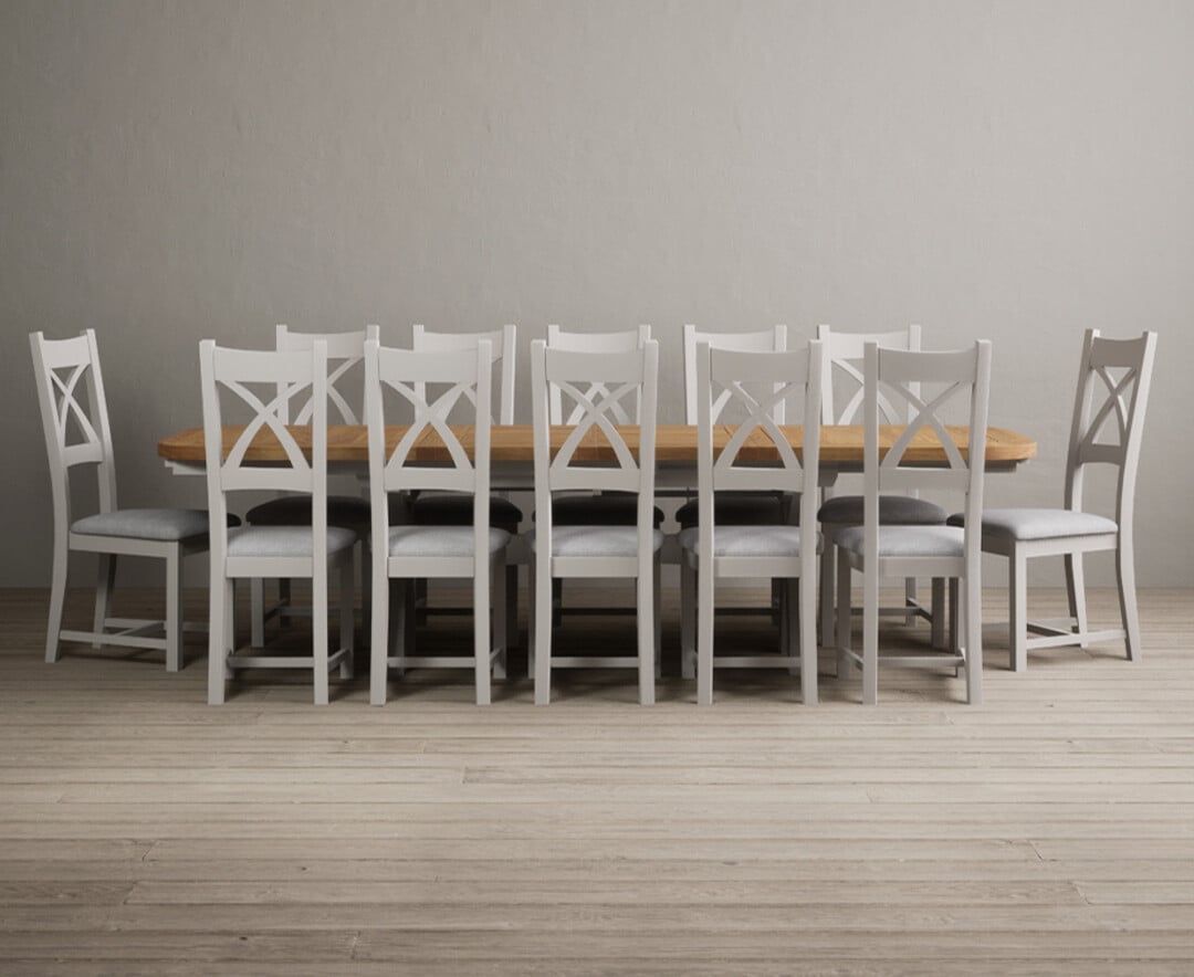 Product photograph of Atlas 180cm Oak And Soft White Extending Dining Table With 12 Charcoal Grey X Back Chairs from Oak Furniture Superstore