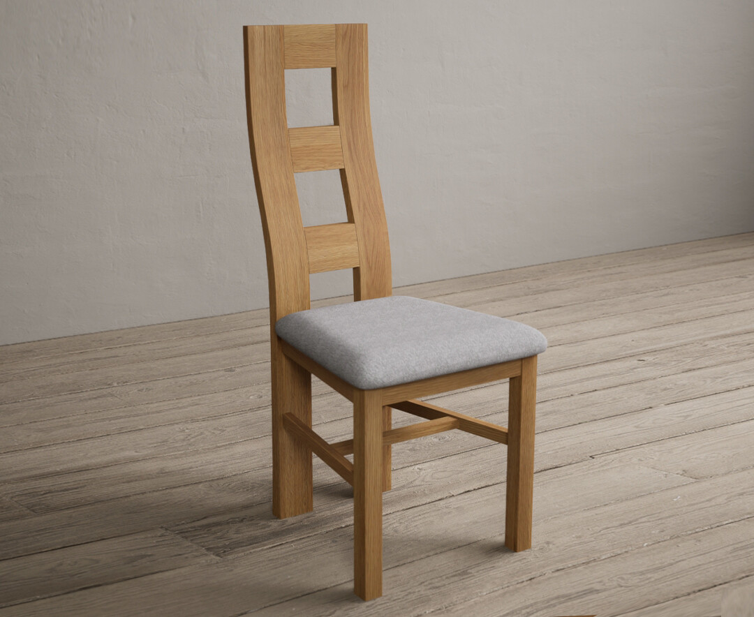 Photo 2 of Natural solid oak flow back dining chairs with light grey fabric seat pad