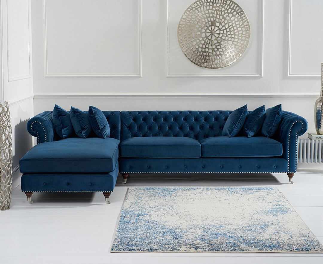 Product photograph of Chiswick Extra Large Blue Velvet Left Facing Chesterfield Corner Chaise Sofa from Oak Furniture Superstore