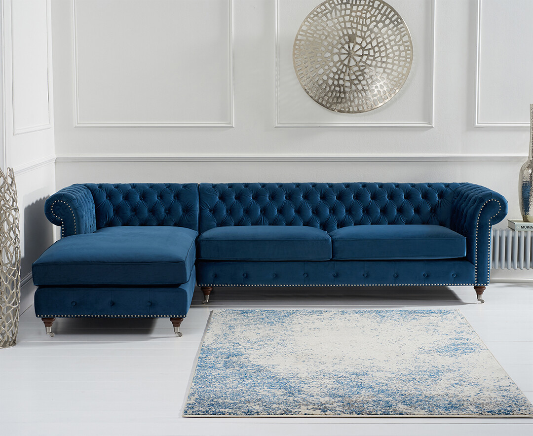 Product photograph of Chiswick Extra Large Blue Velvet Left Facing Chesterfield Corner Chaise Sofa from Oak Furniture Superstore.