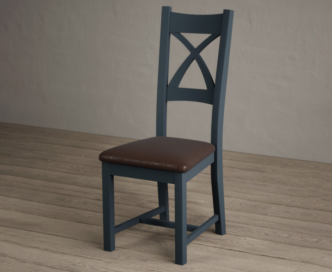 Photo 2 of Painted dark blue x back dining chairs with brown suede seat pad