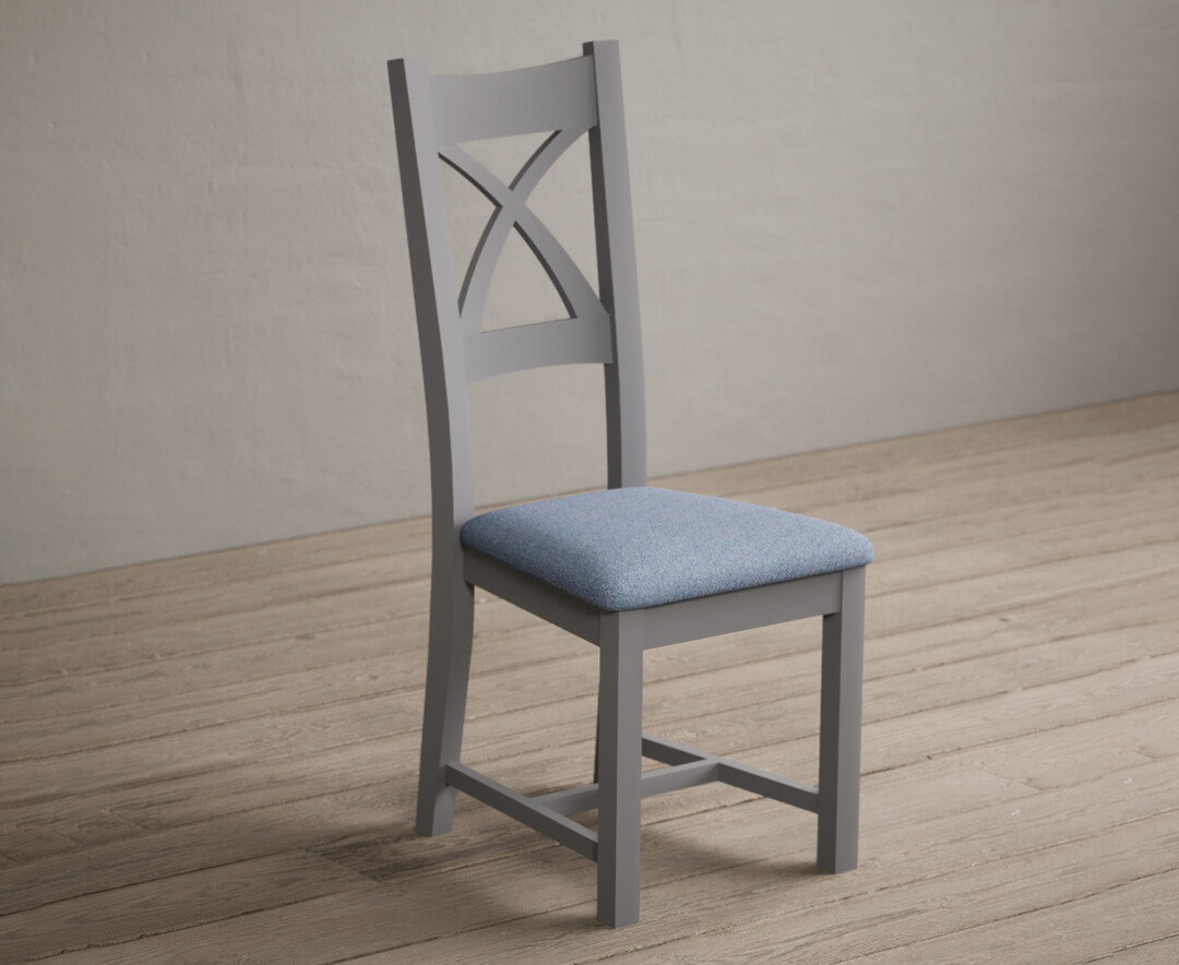 Photo 1 of Painted light grey x back dining chairs with blue fabric seat pad