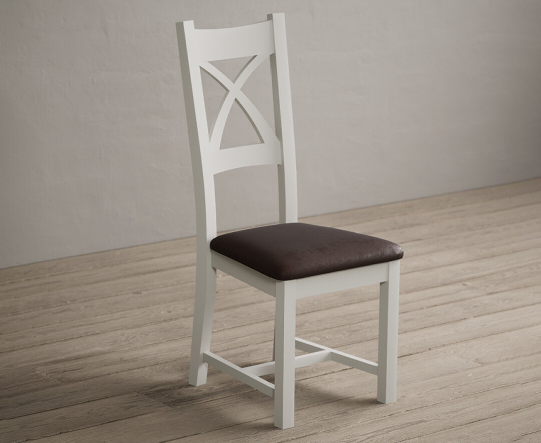 Photo 1 of Painted signal white x back dining chairs with brown suede seat pad