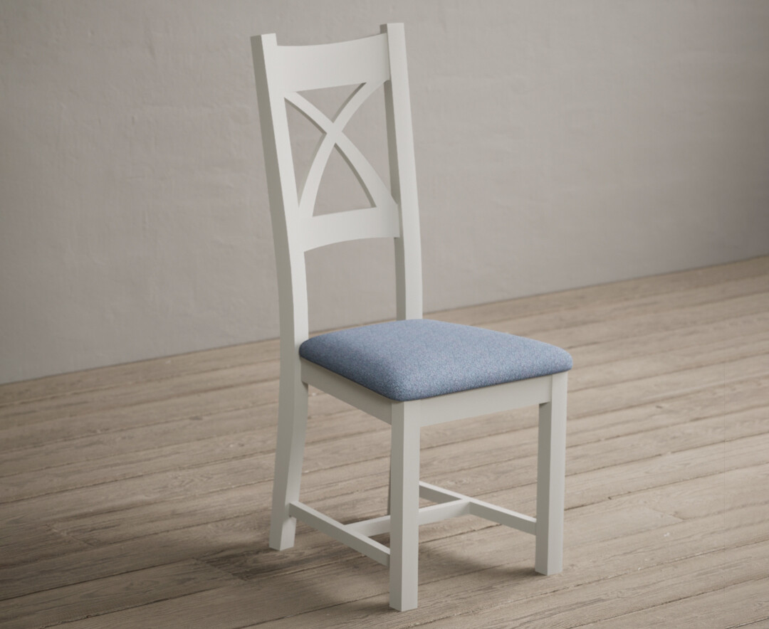 Photo 1 of Painted signal white x back dining chairs with blue fabric seat pad