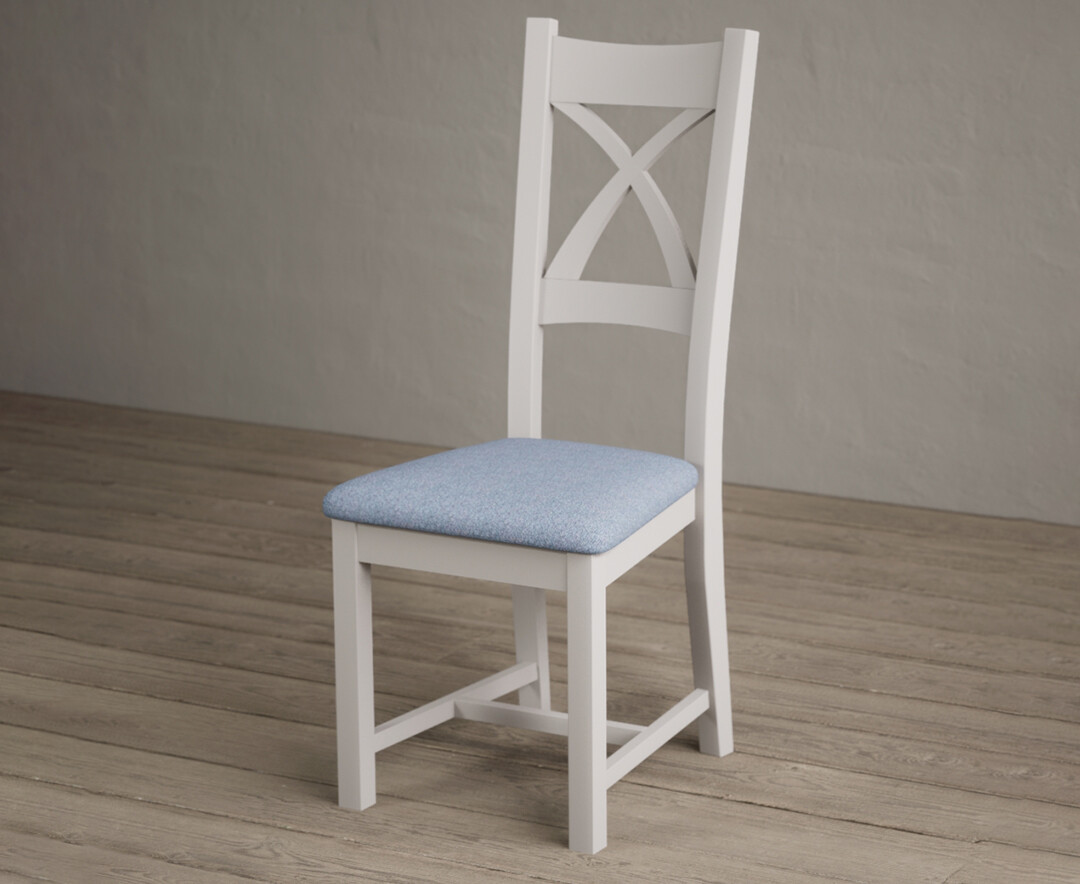Photo 2 of Painted soft white x back dining chairs with blue fabric seat pad