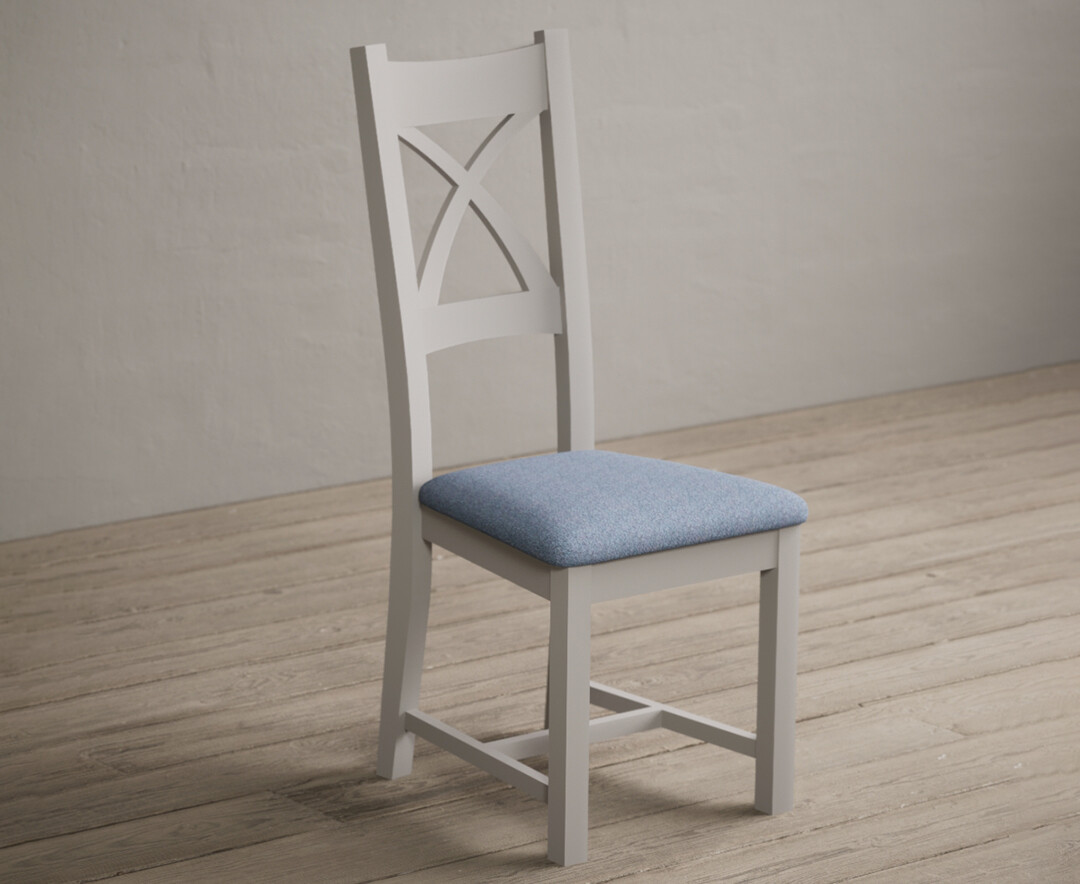 Photo 1 of Painted soft white x back dining chairs with blue fabric seat pad