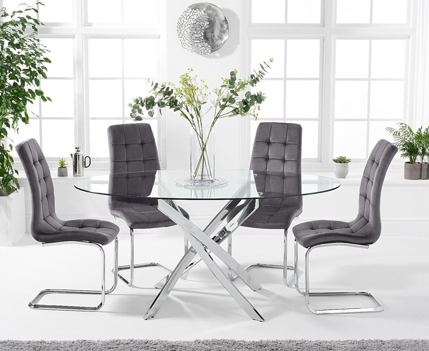 Product photograph of Bernini 165cm Oval Glass Dining Table With 8 Grey Vigo Velvet Chairs from Oak Furniture Superstore