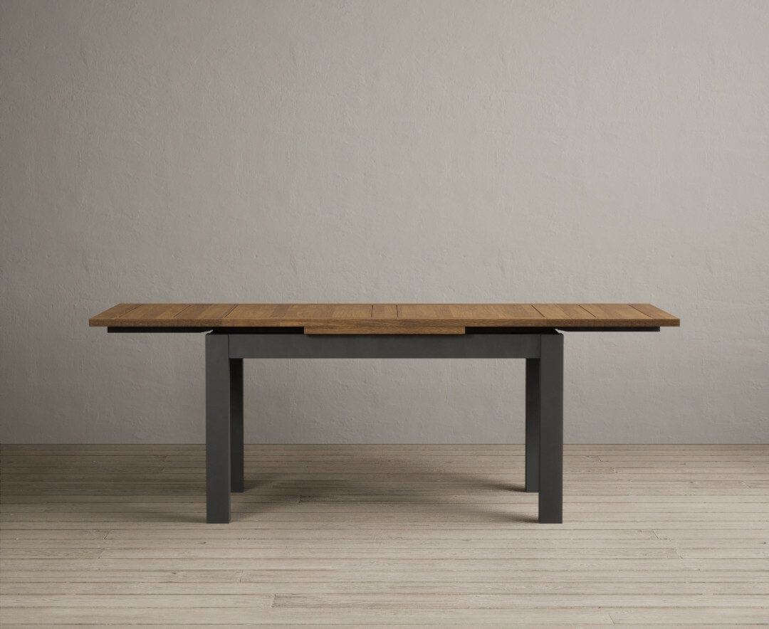 Product photograph of Extending Buxton 140cm Oak And Charcoal Grey Painted Dining Table from Oak Furniture Superstore
