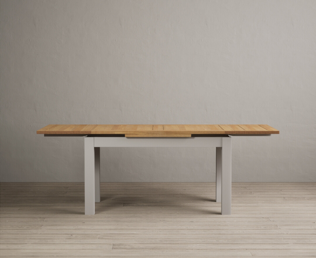 Product photograph of Extending Buxton 140cm Oak And Soft White Painted Dining Table from Oak Furniture Superstore