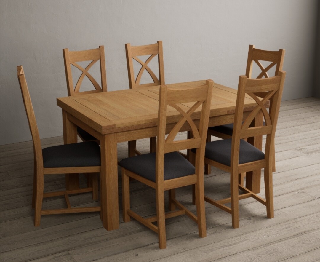 Photo 1 of Extending buxton 140cm solid oak dining table with 10 linen x back chairs