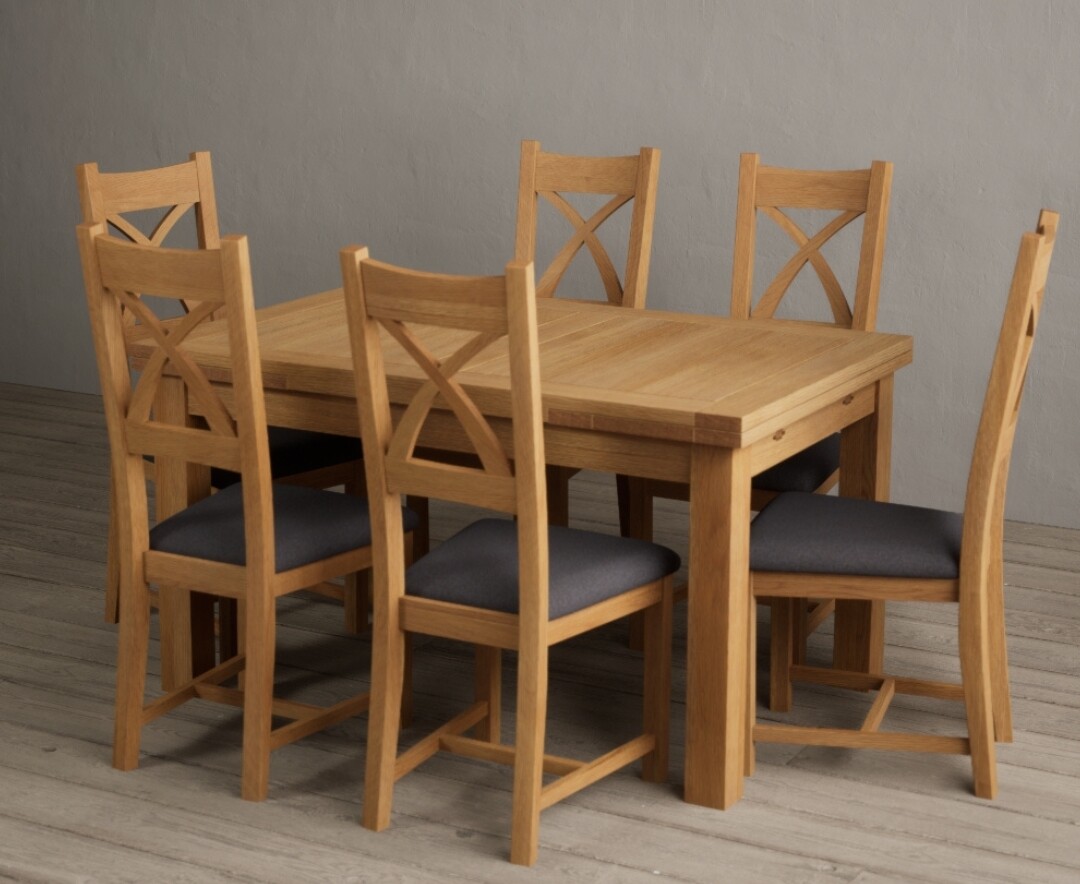 Photo 2 of Extending buxton 140cm solid oak dining table with 10 linen x back chairs