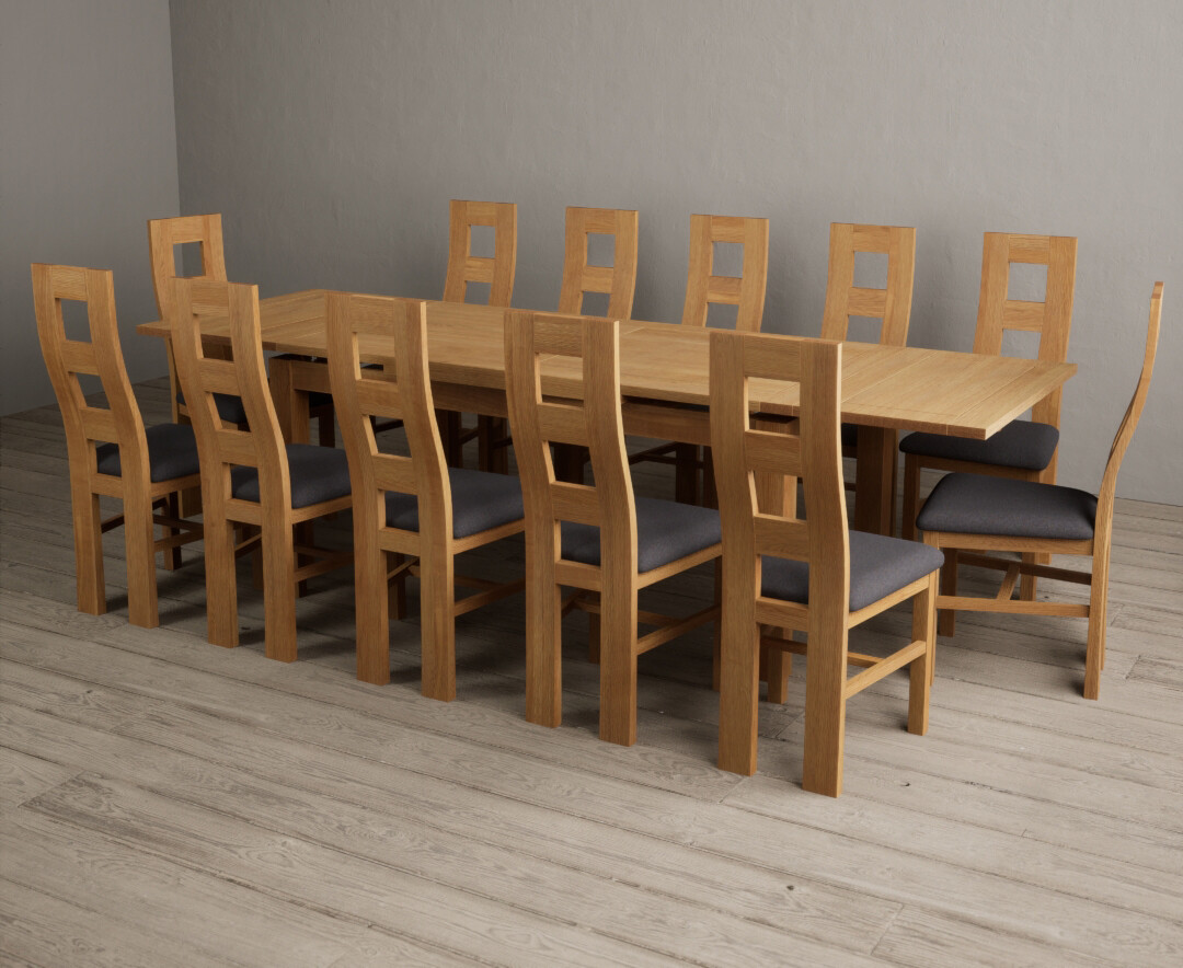 Photo 2 of Extending buxton 180cm solid oak dining table with 12 light grey flow back chairs
