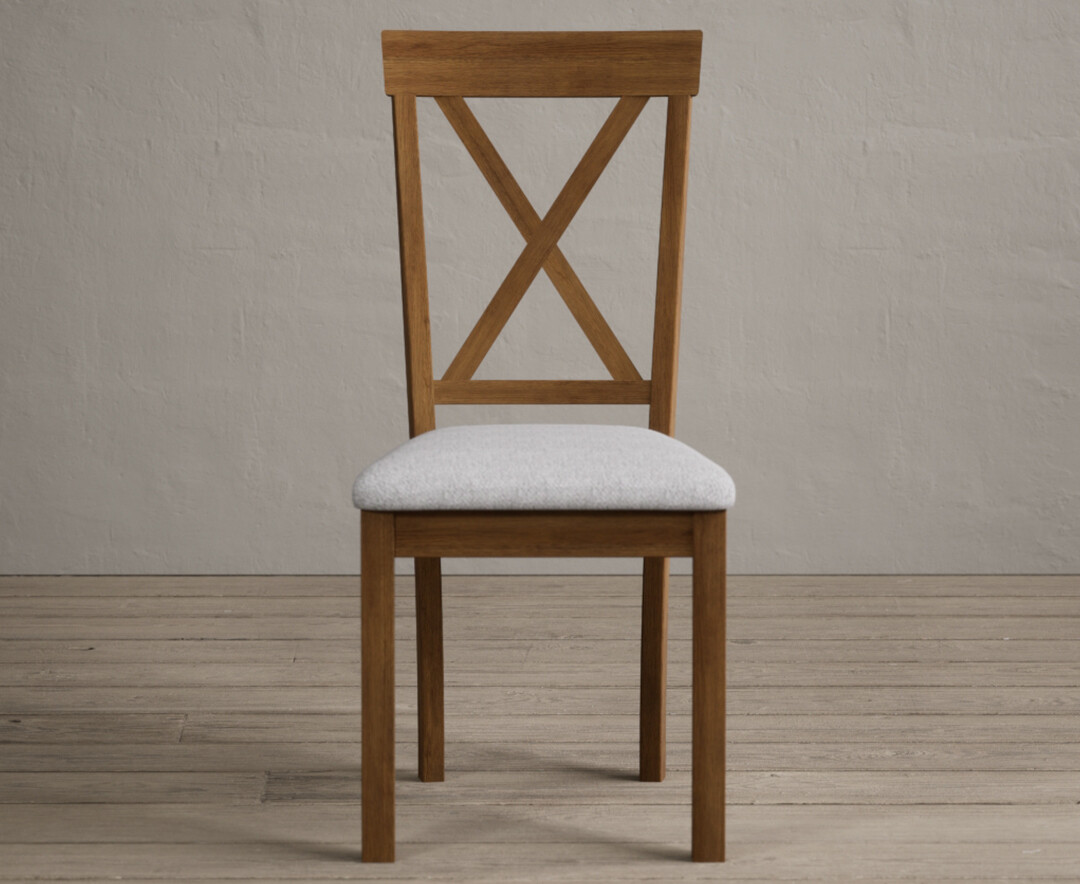 Product photograph of Hertford Rustic Oak Dining Chairs With Light Grey Fabric Seat Pad from Oak Furniture Superstore