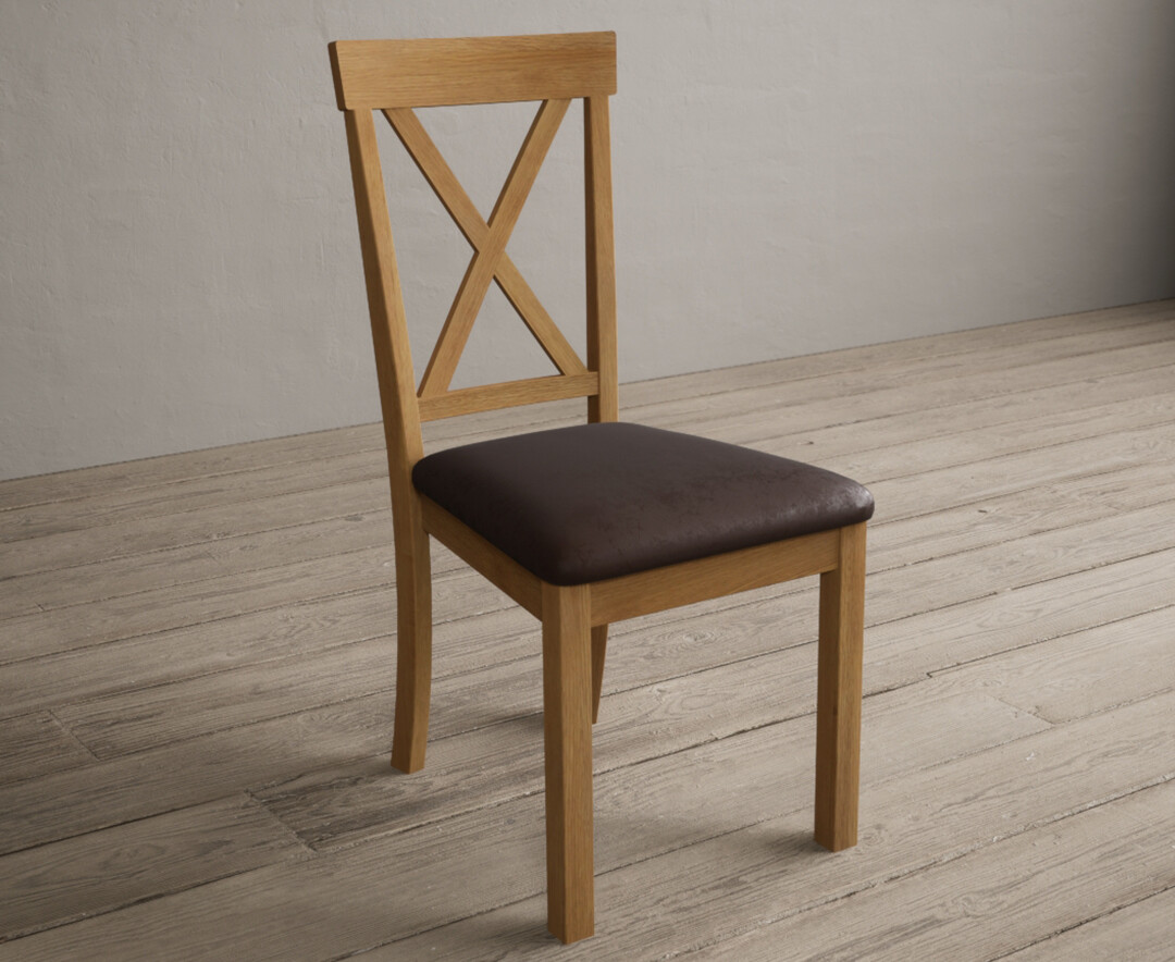 Photo 1 of Hertford solid oak dining chairs with brown suede seat pad