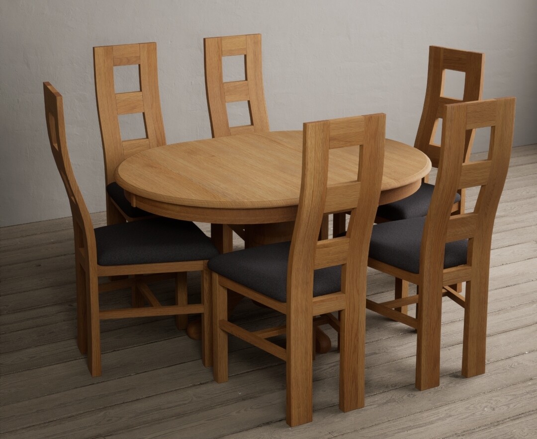 Photo 1 of Extending hertford 100cm - 130cm solid oak pedestal dining table with 6 brown flow back chairs