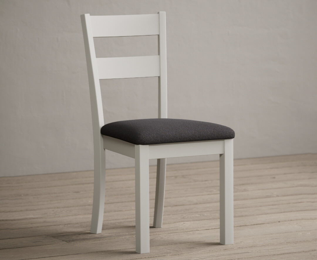 Photo 1 of Kendal signal white painted dining chairs with charcoal grey fabric seat pad