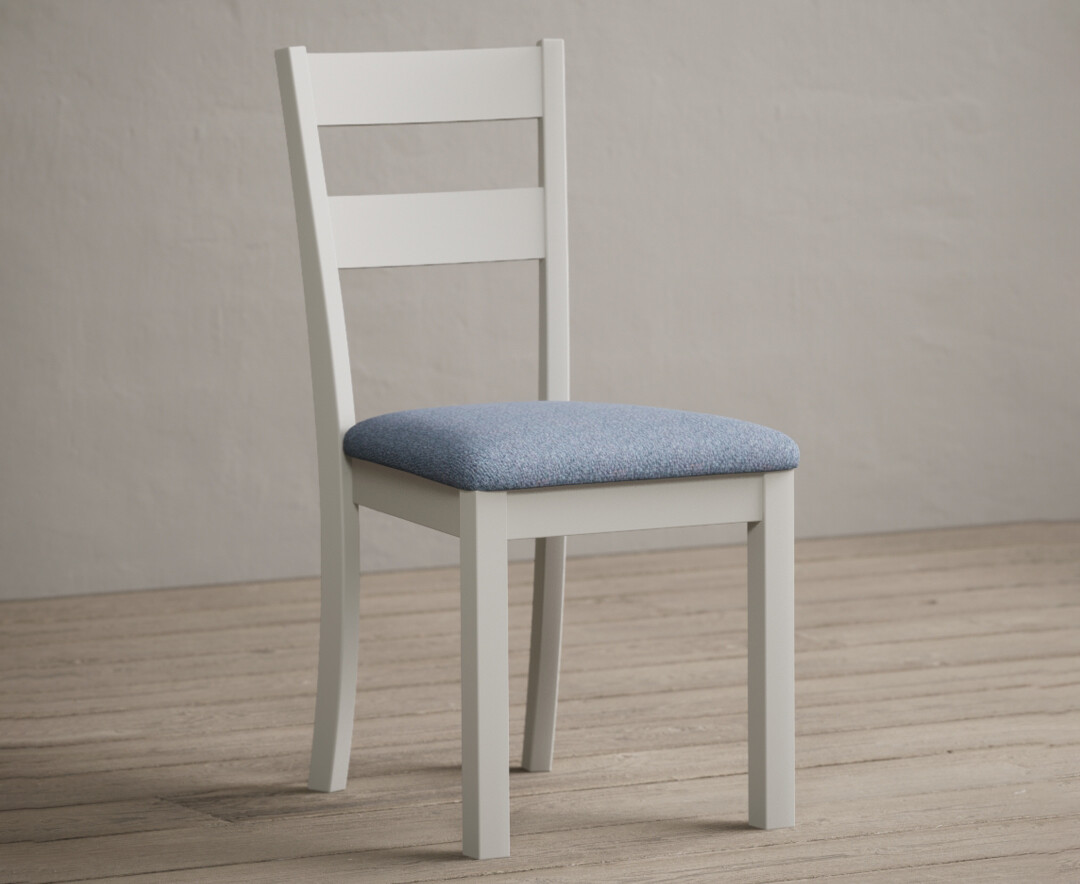 Photo 1 of Kendal signal white painted dining chairs with blue fabric seat pad