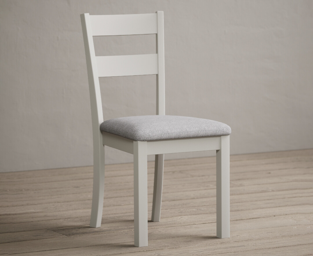 Photo 1 of Kendal signal white painted dining chairs with light grey fabric seat pad
