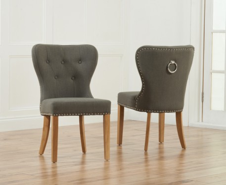 Product photograph of Keswick Studded Grey Fabric Oak Leg Dining Chairs from Oak Furniture Superstore