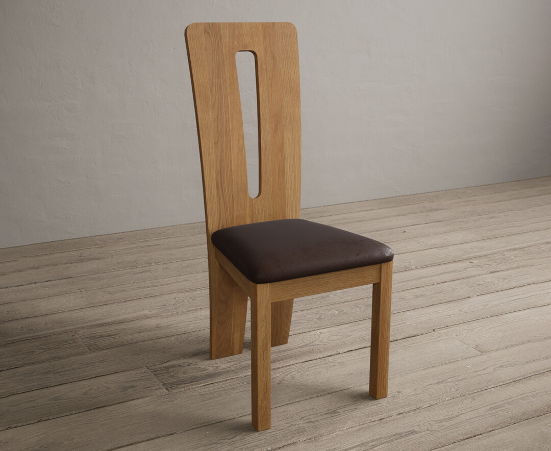 Photo 1 of Lucca solid oak dining chairs with brown suede seat pad