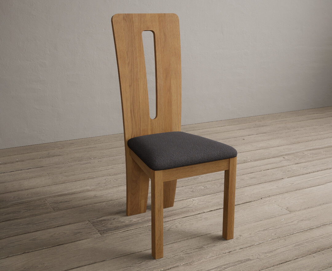 Photo 1 of Lucca solid oak dining chairs with charcoal grey fabric seat pad