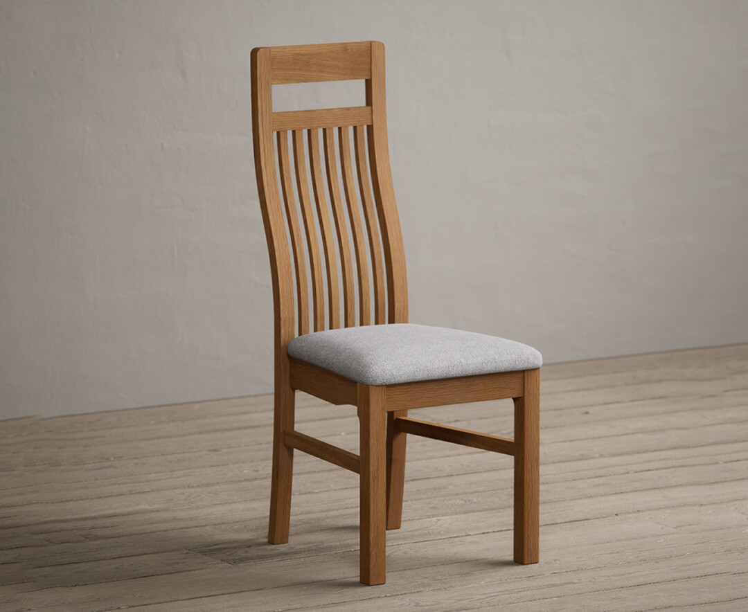 Product photograph of Monroe Solid Oak Dining Chairs With Light Grey Fabric Seat Pad from Oak Furniture Superstore.