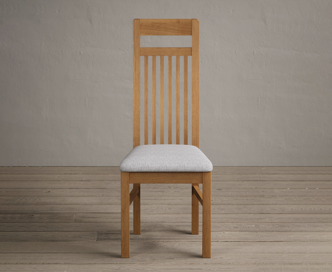 Product photograph of Monroe Solid Oak Dining Chairs With Light Grey Fabric Seat Pad from Oak Furniture Superstore