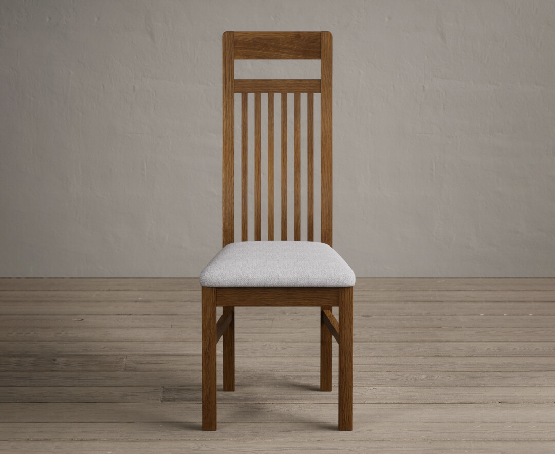 Product photograph of Monroe Rustic Oak Dining Chairs With Light Grey Fabric Seat Pad from Oak Furniture Superstore