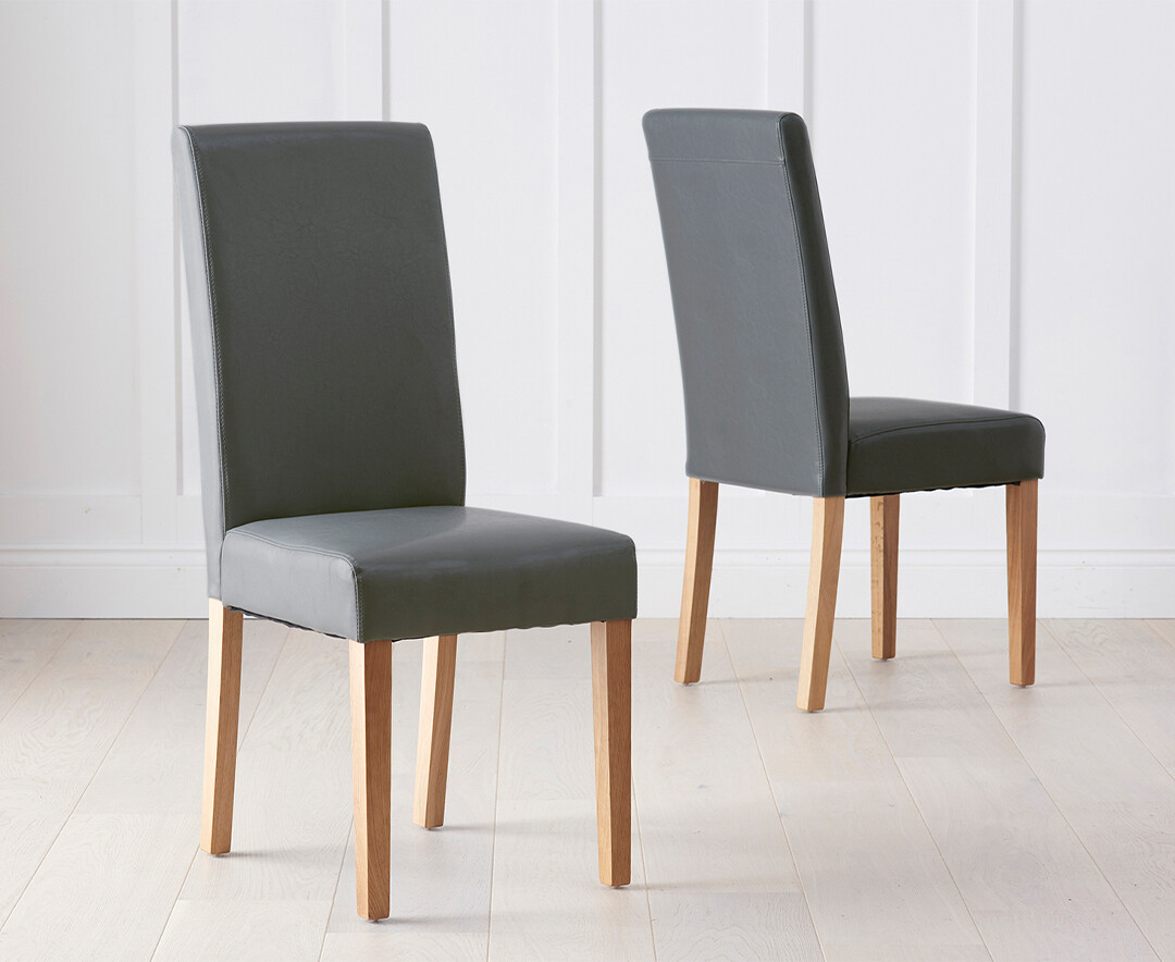 Product photograph of Olivia Grey Faux Leather Dining Chairs from Oak Furniture Superstore