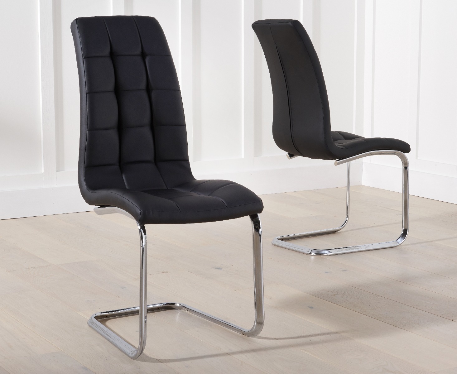 Product photograph of Vigo Black Faux Leather Dining Chairs from Oak Furniture Superstore