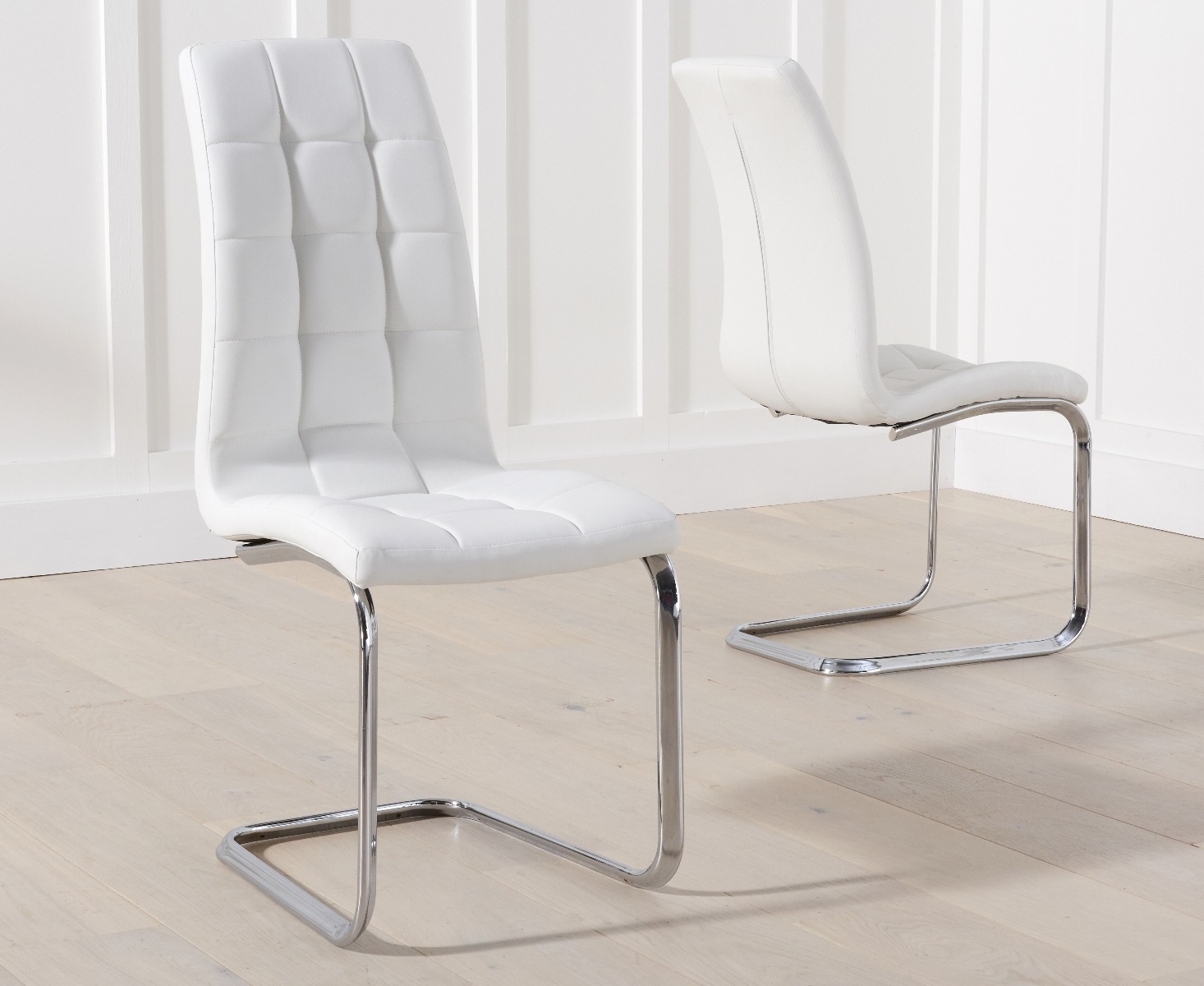Product photograph of Vigo White Faux Leather Dining Chairs from Oak Furniture Superstore