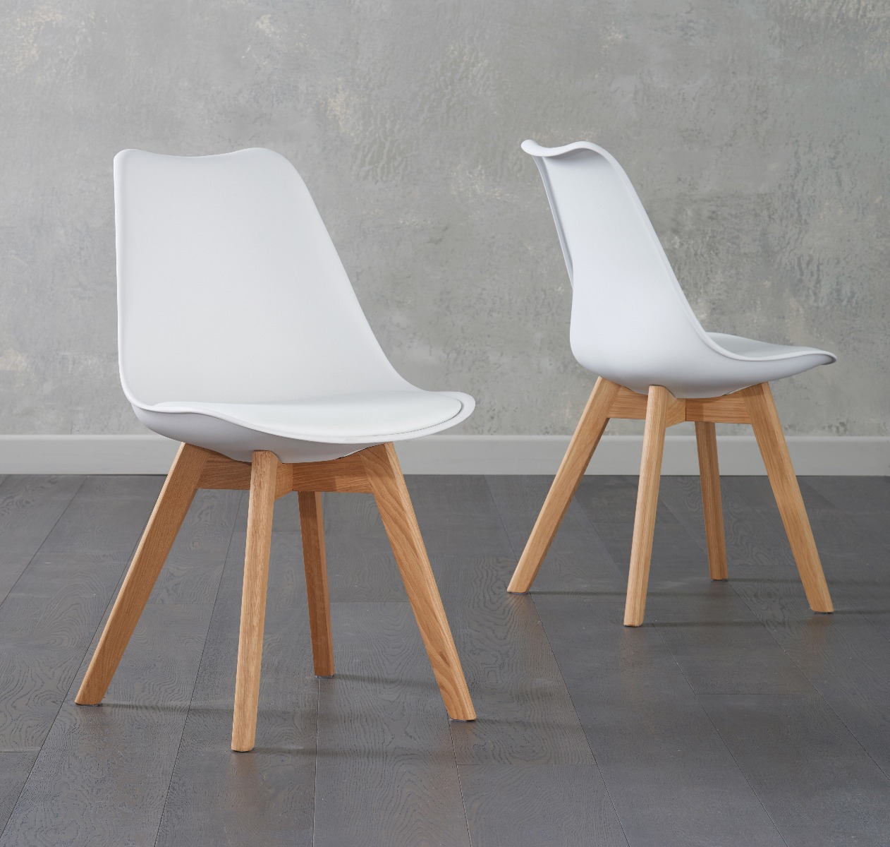 Product photograph of Orson White Faux Leather Dining Chairs from Oak Furniture Superstore