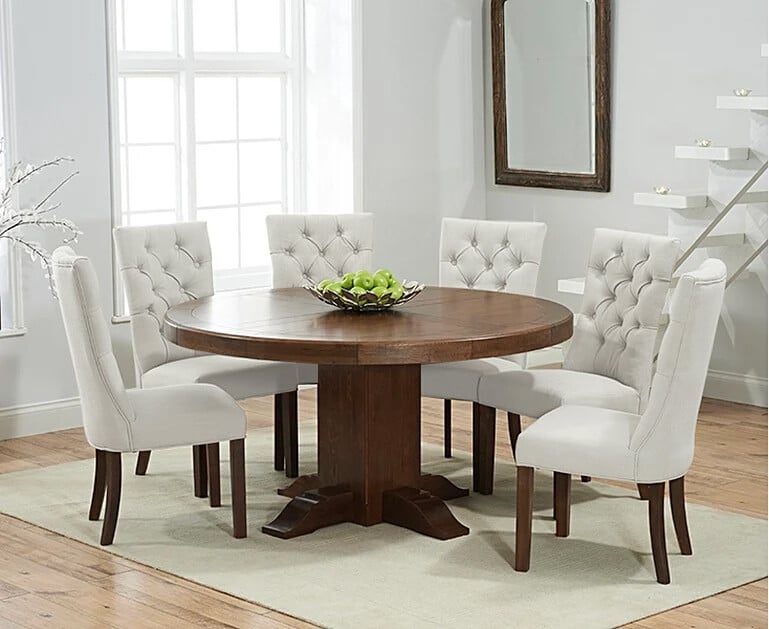 Helmsley 150cm Dark Solid Oak Round Pedestal Dining Table With 6 Cream Francois Fabric Dark Oak Leg Chairs