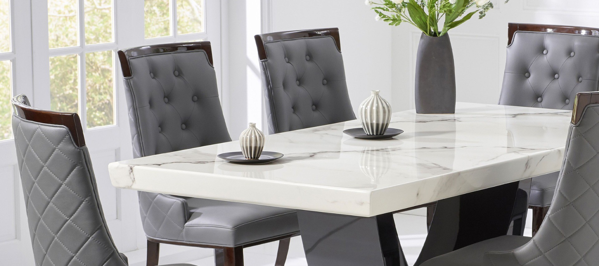 Photo 2 of Raphael 200cm white and black pedestal marble dining table with 10 cream francesca chairs