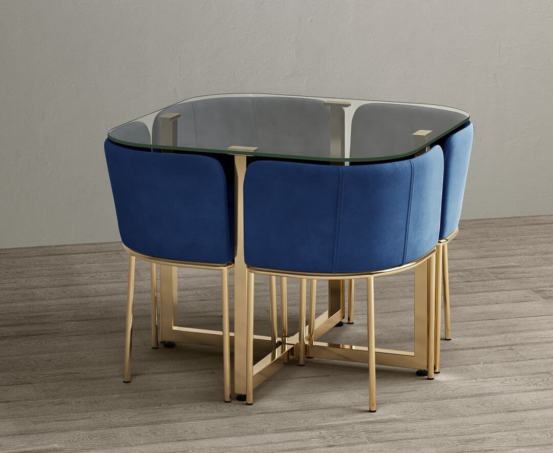 Product photograph of Rhodes Glass Stowaway Dining Table Gold Leg With Blue Velvet High Back Stools from Oak Furniture Superstore.