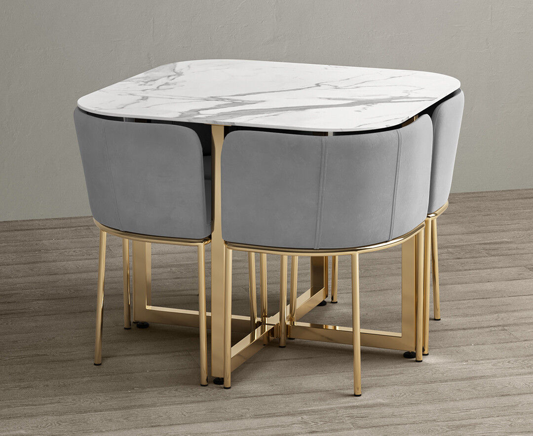 Photo 1 of Rhodes white marble gold leg stowaway dining table with grey velvet gold leg high back stools