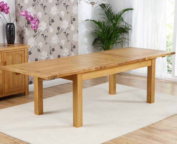 Photo 2 of Normandy 180cm solid oak extending dining table with 4 grey beatrix fabric chairs